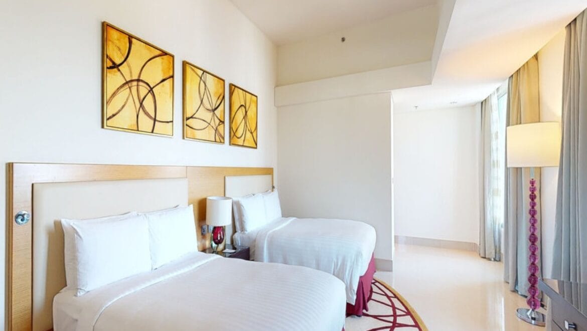 Interior view of a modern 3-bedroom Marriott Executive Apartments in Al Jaddaf, Dubai, featuring a spacious living area and a maid's room.-Propertyana real estate in dubai and sharjeh