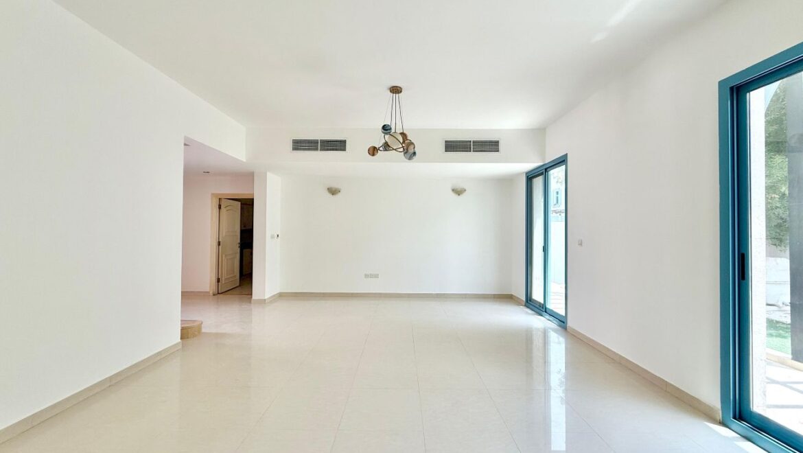 Exterior view of a four-bedroom Aegean-style villa in Western Residence North, Falcon City of Wonders, Dubai, featuring modern architecture and lush landscaping.-Propertyana real estate in dubai and sharjeh