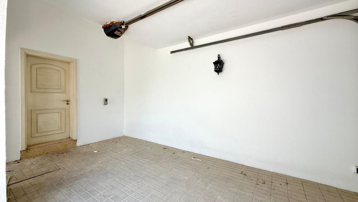 Exterior view of a four-bedroom Aegean-style villa in Western Residence North, Falcon City of Wonders, Dubai, featuring modern architecture and lush landscaping.-Propertyana real estate in dubai and sharjeh