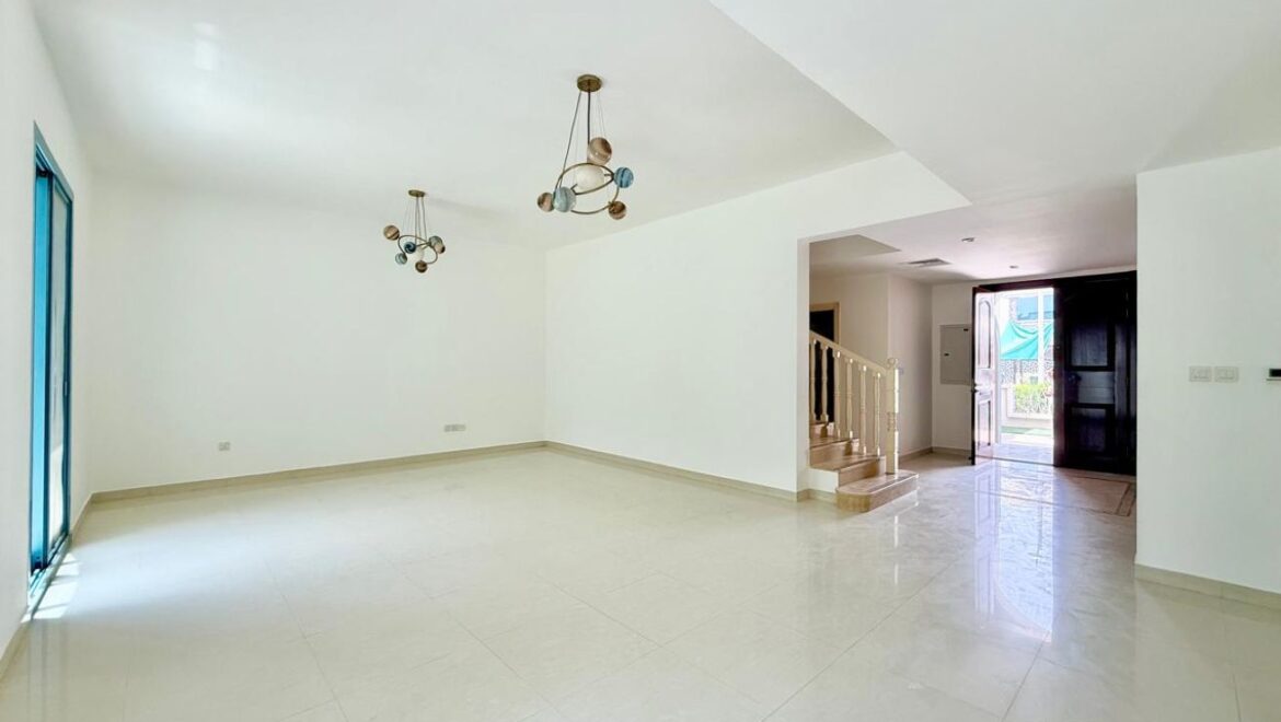 Exterior view of a four-bedroom Aegean-style villa in Western Residence North, Falcon City of Wonders, Dubai, featuring modern architecture and lush landscaping.-Propertyana real estate in dubai and sharjeh