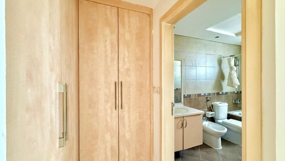 Exterior view of a four-bedroom Aegean-style villa in Western Residence North, Falcon City of Wonders, Dubai, featuring modern architecture and lush landscaping.-Propertyana real estate in dubai and sharjeh