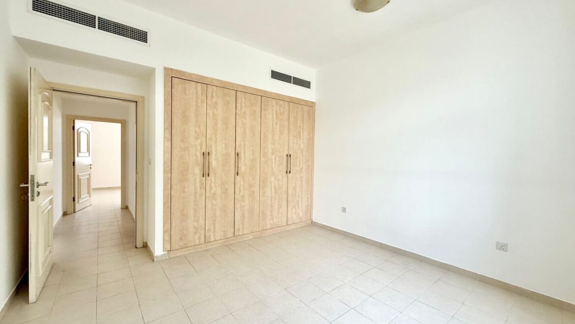 Exterior view of a four-bedroom Aegean-style villa in Western Residence North, Falcon City of Wonders, Dubai, featuring modern architecture and lush landscaping.-Propertyana real estate in dubai and sharjeh