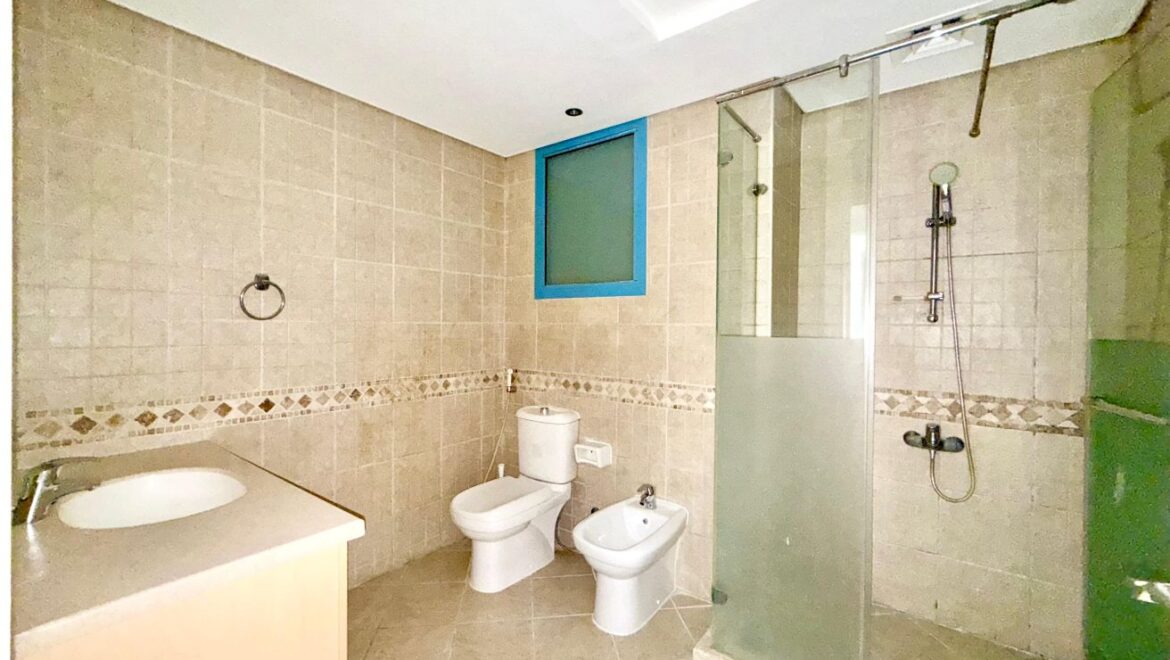 Exterior view of a four-bedroom Aegean-style villa in Western Residence North, Falcon City of Wonders, Dubai, featuring modern architecture and lush landscaping.-Propertyana real estate in dubai and sharjeh