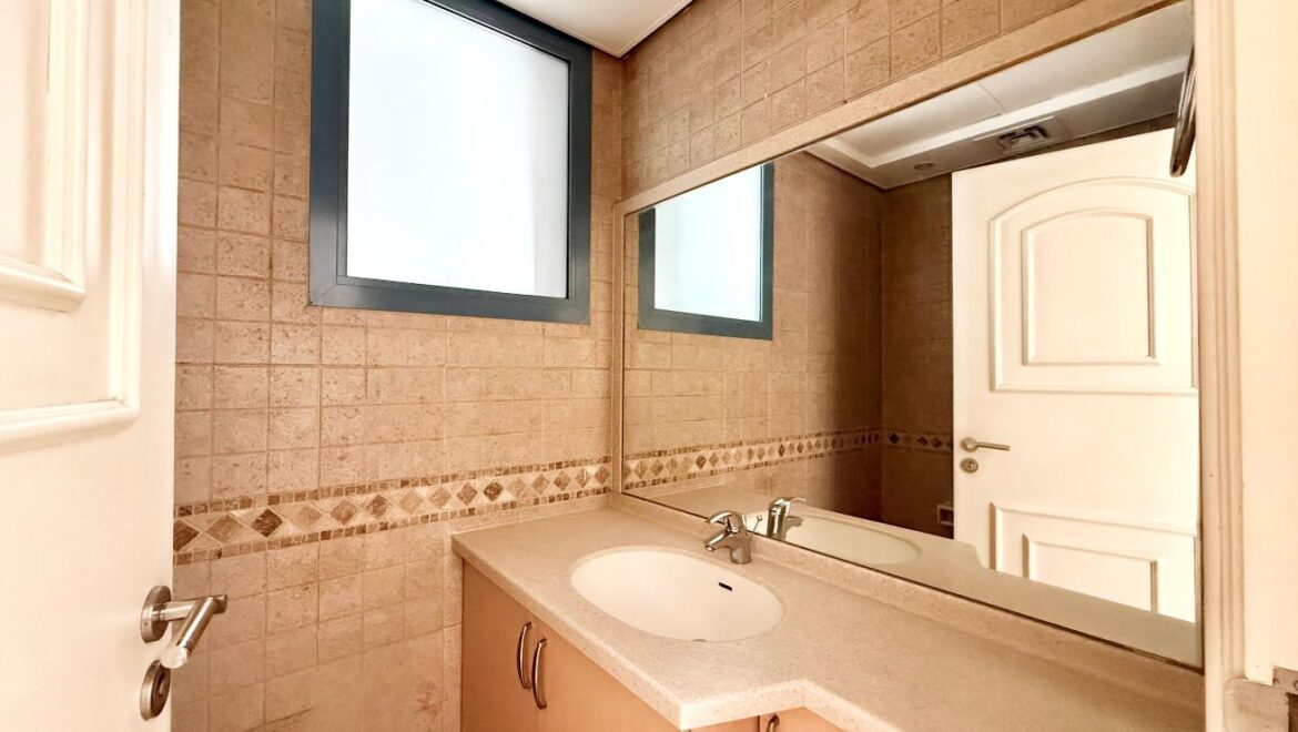 Exterior view of a four-bedroom Aegean-style villa in Western Residence North, Falcon City of Wonders, Dubai, featuring modern architecture and lush landscaping.-Propertyana real estate in dubai and sharjeh