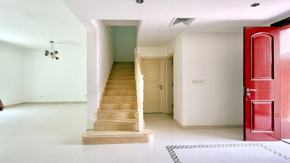 Exterior view of a four-bedroom Aegean-style villa in Western Residence North, Falcon City of Wonders, Dubai, featuring modern architecture and lush landscaping.-Propertyana real estate in dubai and sharjeh