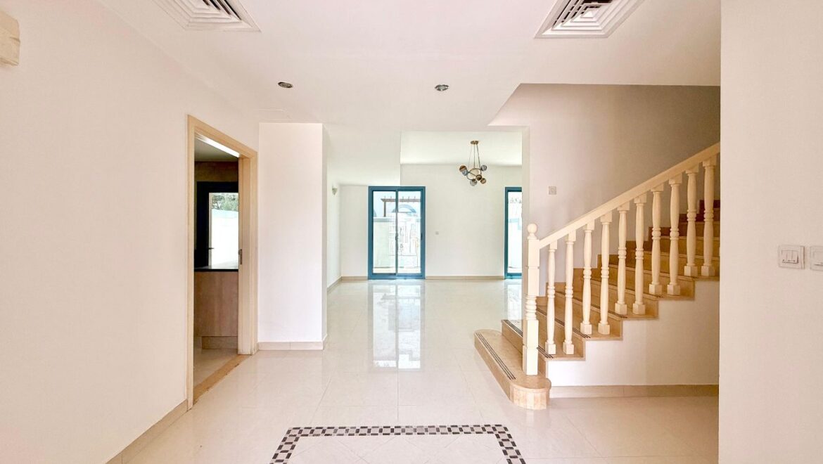 Exterior view of a four-bedroom Aegean-style villa in Western Residence North, Falcon City of Wonders, Dubai, featuring modern architecture and lush landscaping.-Propertyana real estate in dubai and sharjeh