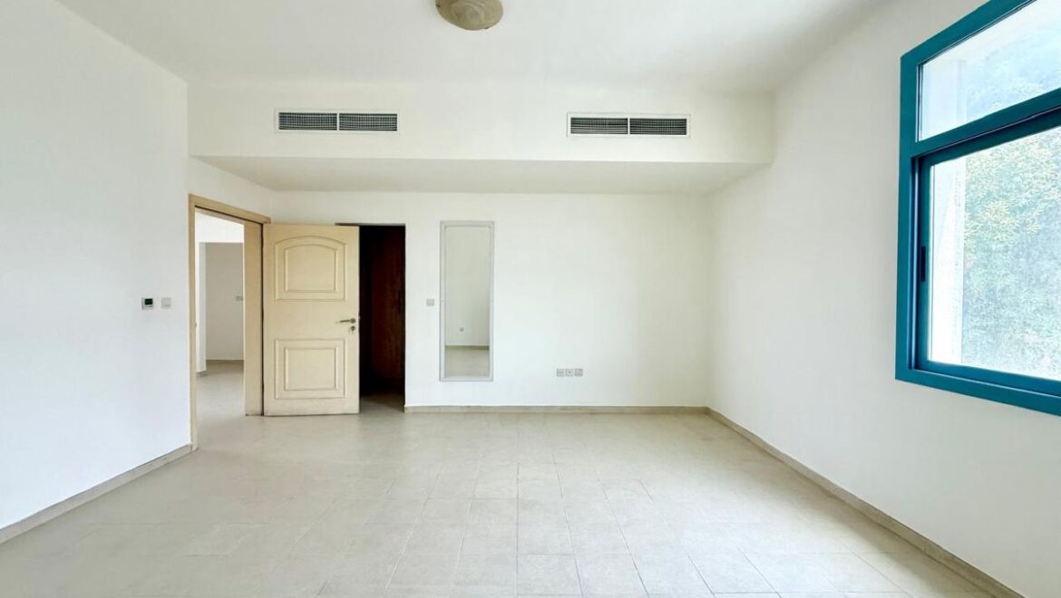 Exterior view of a four-bedroom Aegean-style villa in Western Residence North, Falcon City of Wonders, Dubai, featuring modern architecture and lush landscaping.-Propertyana real estate in dubai and sharjeh