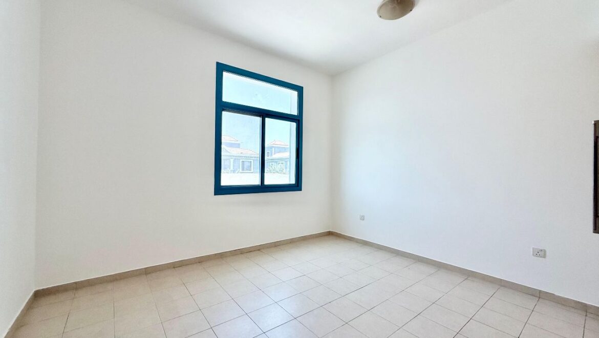 Exterior view of a four-bedroom Aegean-style villa in Western Residence North, Falcon City of Wonders, Dubai, featuring modern architecture and lush landscaping.-Propertyana real estate in dubai and sharjeh