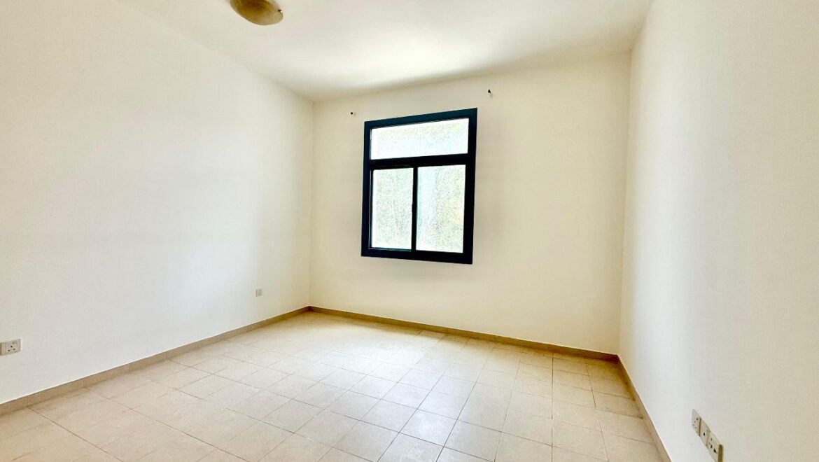 Exterior view of a four-bedroom Aegean-style villa in Western Residence North, Falcon City of Wonders, Dubai, featuring modern architecture and lush landscaping.-Propertyana real estate in dubai and sharjeh