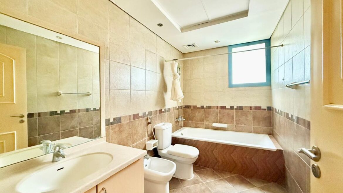 Exterior view of a four-bedroom Aegean-style villa in Western Residence North, Falcon City of Wonders, Dubai, featuring modern architecture and lush landscaping.-Propertyana real estate in dubai and sharjeh