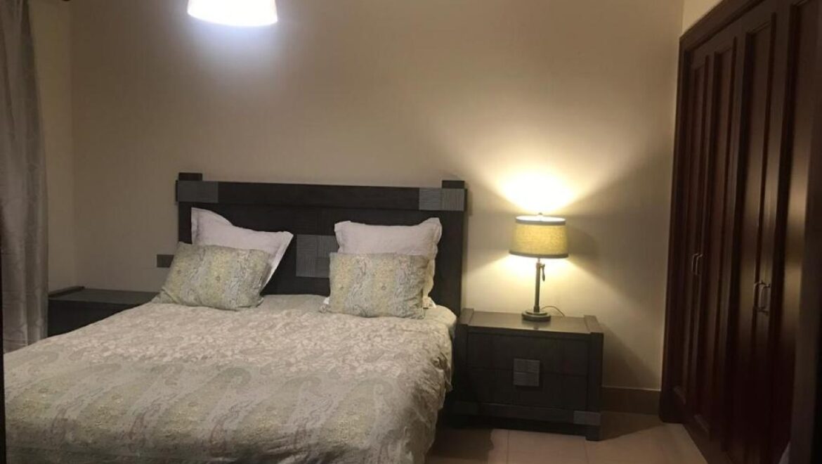 A fully furnished 1-bedroom apartment in Zanzebeel 2, Downtown Dubai, Dubai, featuring a balcony with views of the Burj Khalifa.-Propertyana real estate in dubai and sharjeh