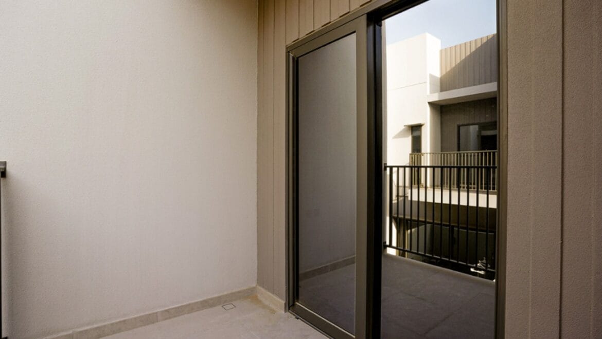 Exterior view of a modern three-bedroom townhouse in MAG Eye, Mohammed Bin Rashid City, Dubai; unfurnished.-Propertyana real estate in dubai and sharjeh