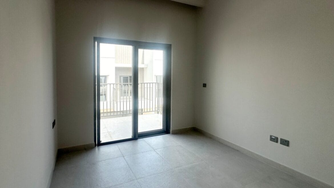 Exterior view of a modern three-bedroom townhouse in MAG Eye, Mohammed Bin Rashid City, Dubai; unfurnished.-Propertyana real estate in dubai and sharjeh