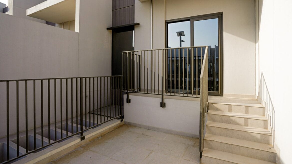 Exterior view of a modern three-bedroom townhouse in MAG Eye, Mohammed Bin Rashid City, Dubai; unfurnished.-Propertyana real estate in dubai and sharjeh