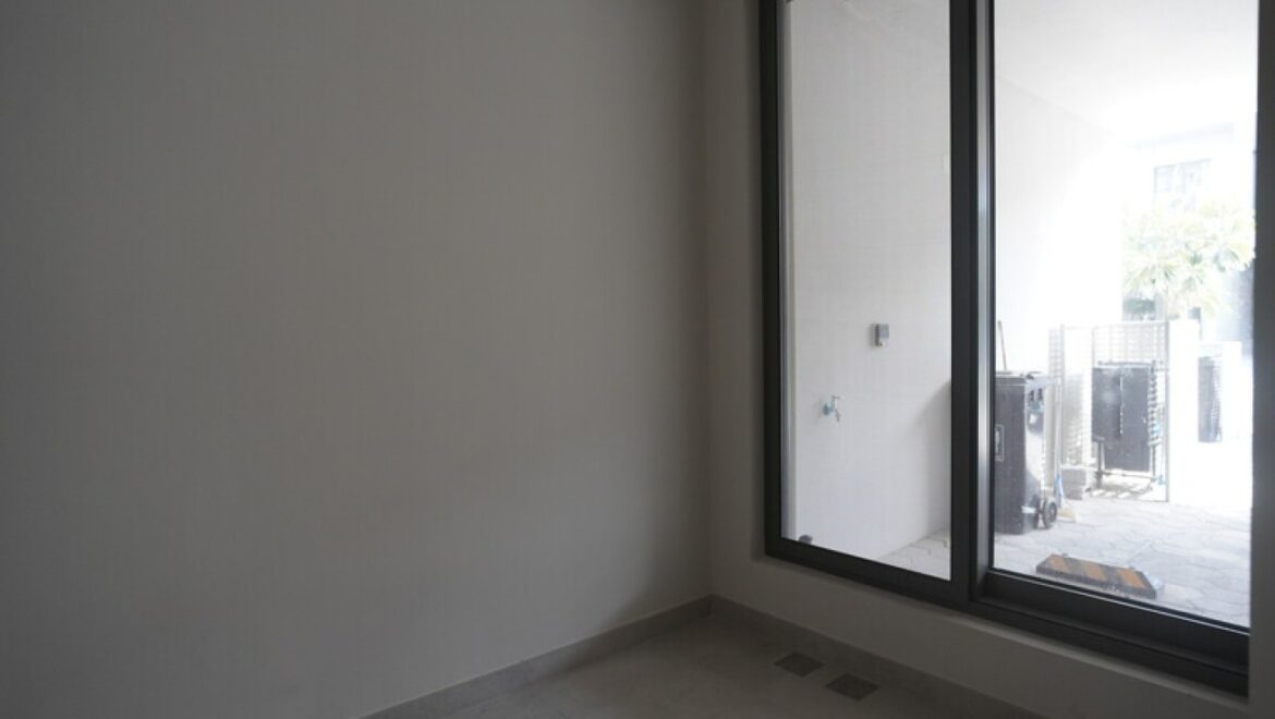 Exterior view of a modern three-bedroom townhouse in MAG Eye, Mohammed Bin Rashid City, Dubai; unfurnished.-Propertyana real estate in dubai and sharjeh