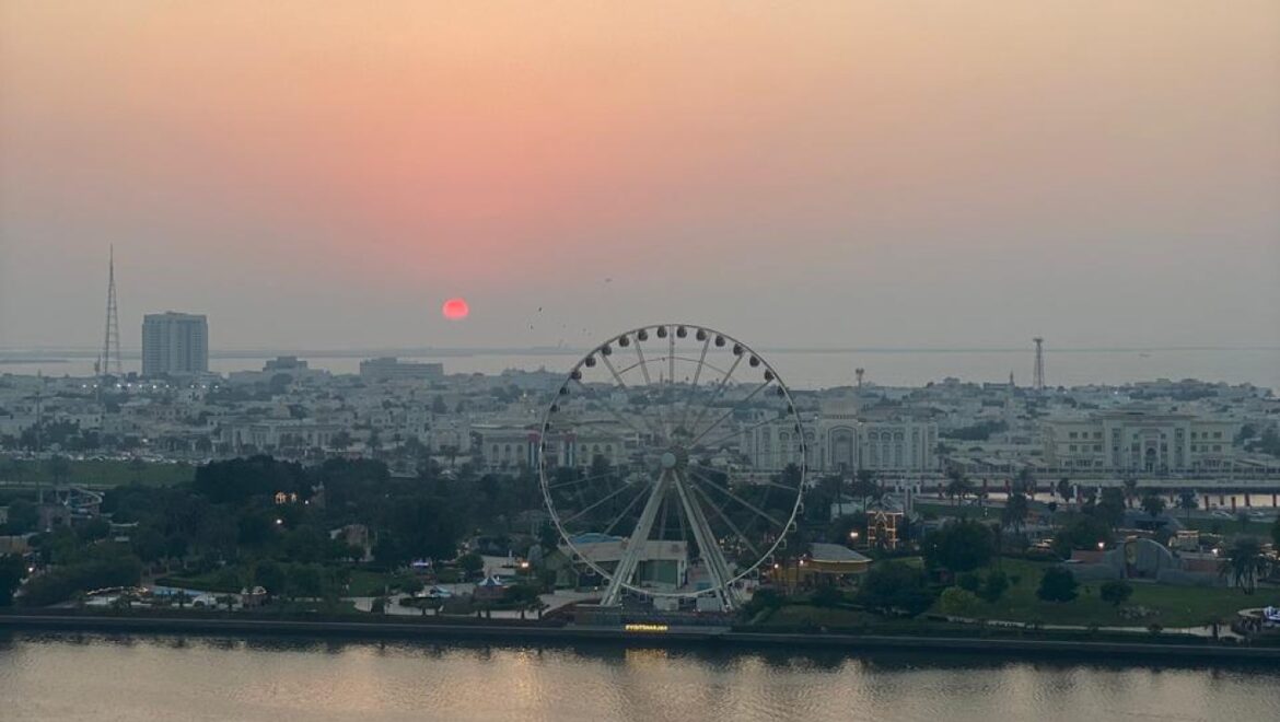 Interior view of a luxury 3-bedroom apartment in Al Majaz 1, Sharjah, featuring a spacious living area with modern furnishings and expansive sea-facing windows.-Propertyana real estate in dubai and sharjeh