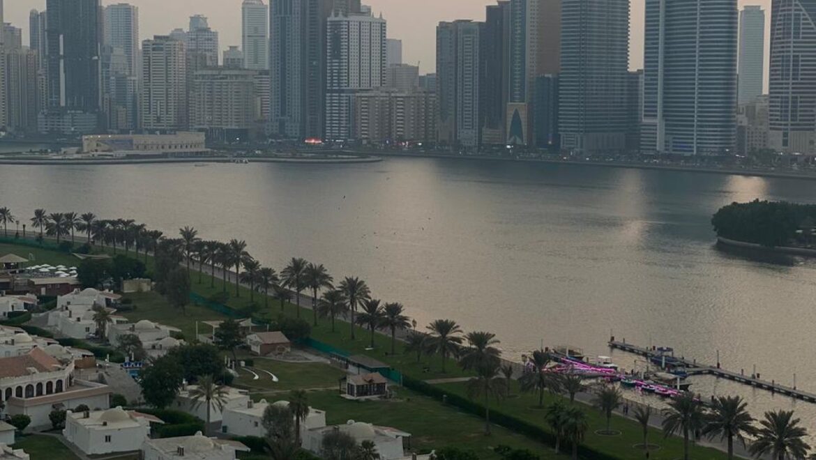 Interior view of a luxury 3-bedroom apartment in Al Majaz 1, Sharjah, featuring a spacious living area with modern furnishings and expansive sea-facing windows.-Propertyana real estate in dubai and sharjeh