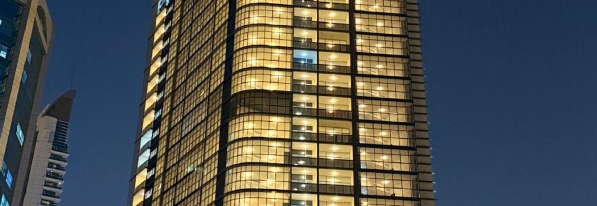 Interior view of a luxury 3-bedroom apartment in Al Majaz 1, Sharjah, featuring a spacious living area with modern furnishings and expansive sea-facing windows.-Propertyana real estate in dubai and sharjeh