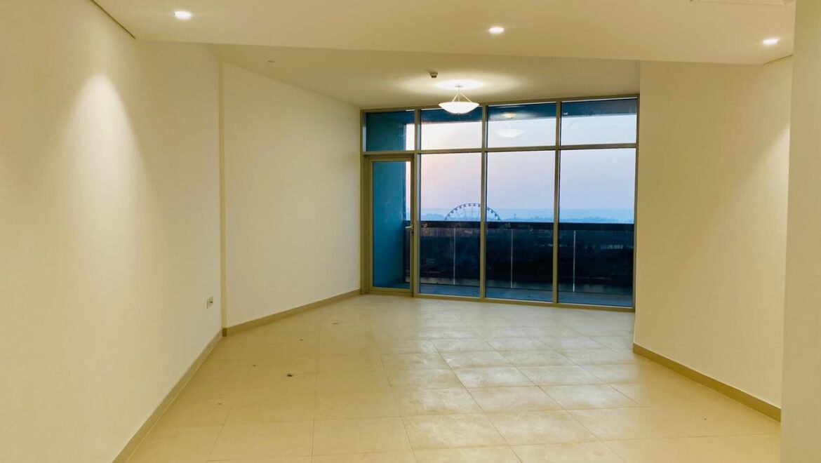 Interior view of a luxury 3-bedroom apartment in Al Majaz 1, Sharjah, featuring a spacious living area with modern furnishings and expansive sea-facing windows.-Propertyana real estate in dubai and sharjeh