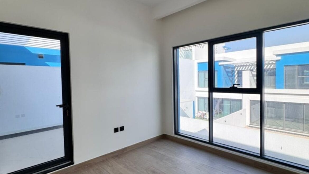 Exterior view of a luxury 3-bedroom townhouse in Santorini at Damac Lagoons, Dubai, residential community.-Propertyana real estate in dubai and sharjeh