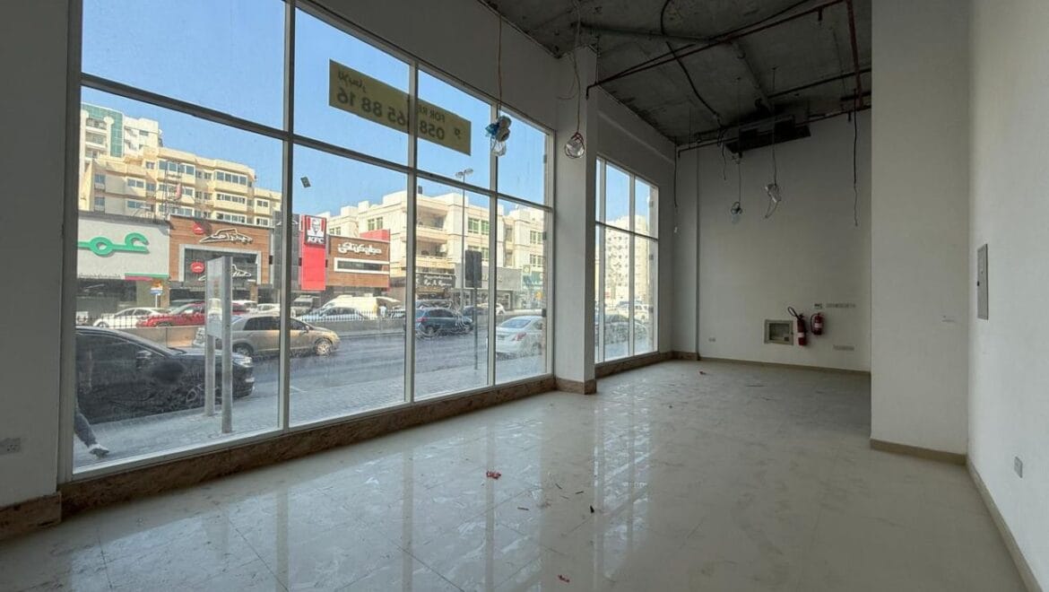 Modern bedroom interior with a queen bed, nightstands and warm ambient lighting, shown as an interior concept for Rolla Square Mall in Sharjah's Rolla Area.-Propertyana real estate in dubai and sharjeh