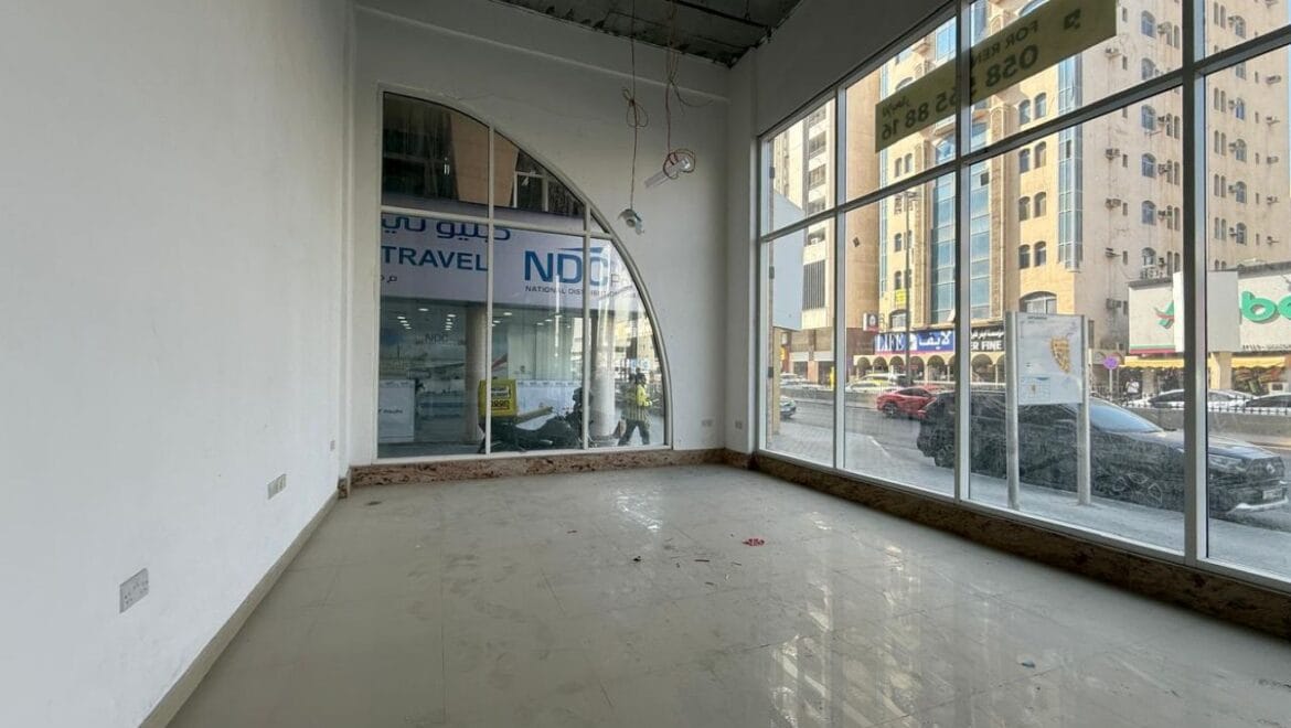 Modern bedroom interior with a queen bed, nightstands and warm ambient lighting, shown as an interior concept for Rolla Square Mall in Sharjah's Rolla Area.-Propertyana real estate in dubai and sharjeh