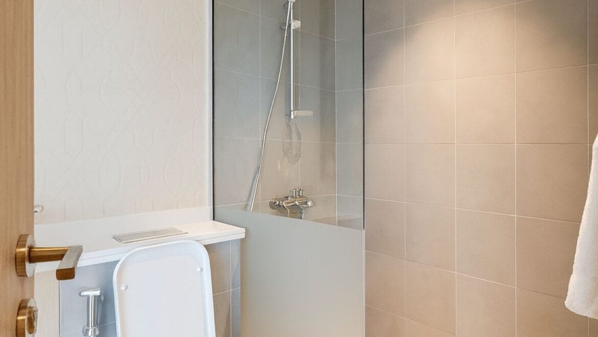 Exterior view of a modern, upgraded 4-bedroom waterfront townhouse in Ajmal Makan City within Sharjah Waterfront City, featuring private beach access.-Propertyana real estate in dubai and sharjeh