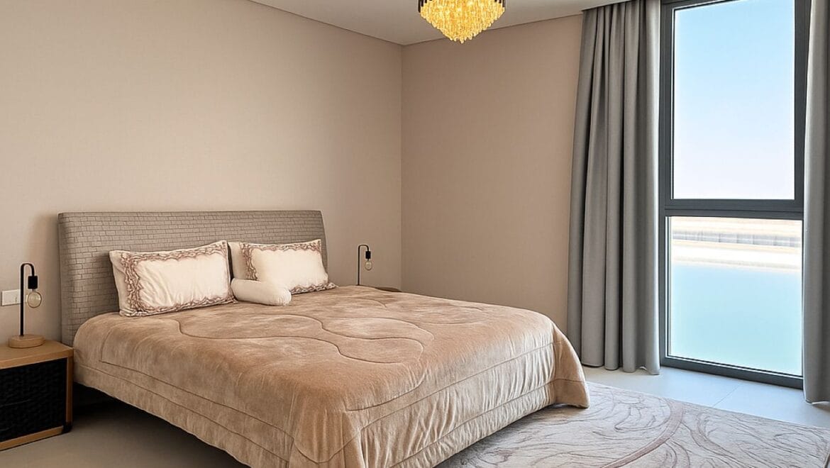 Exterior view of a modern, upgraded 4-bedroom waterfront townhouse in Ajmal Makan City within Sharjah Waterfront City, featuring private beach access.-Propertyana real estate in dubai and sharjeh