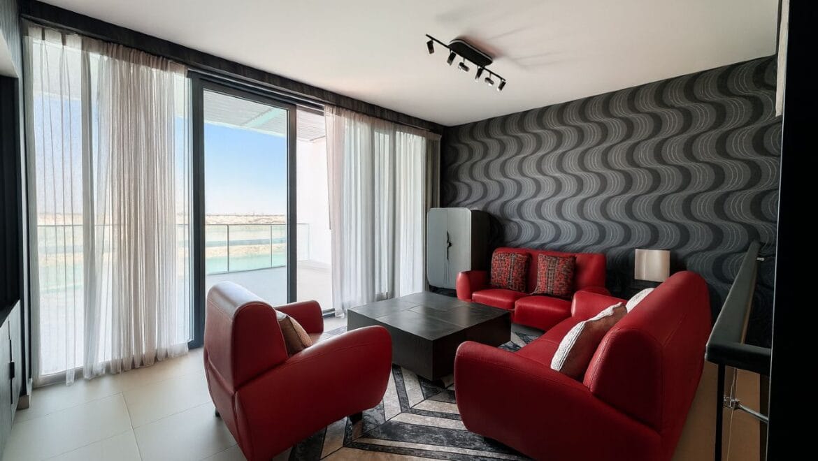 Exterior view of a modern, upgraded 4-bedroom waterfront townhouse in Ajmal Makan City within Sharjah Waterfront City, featuring private beach access.-Propertyana real estate in dubai and sharjeh