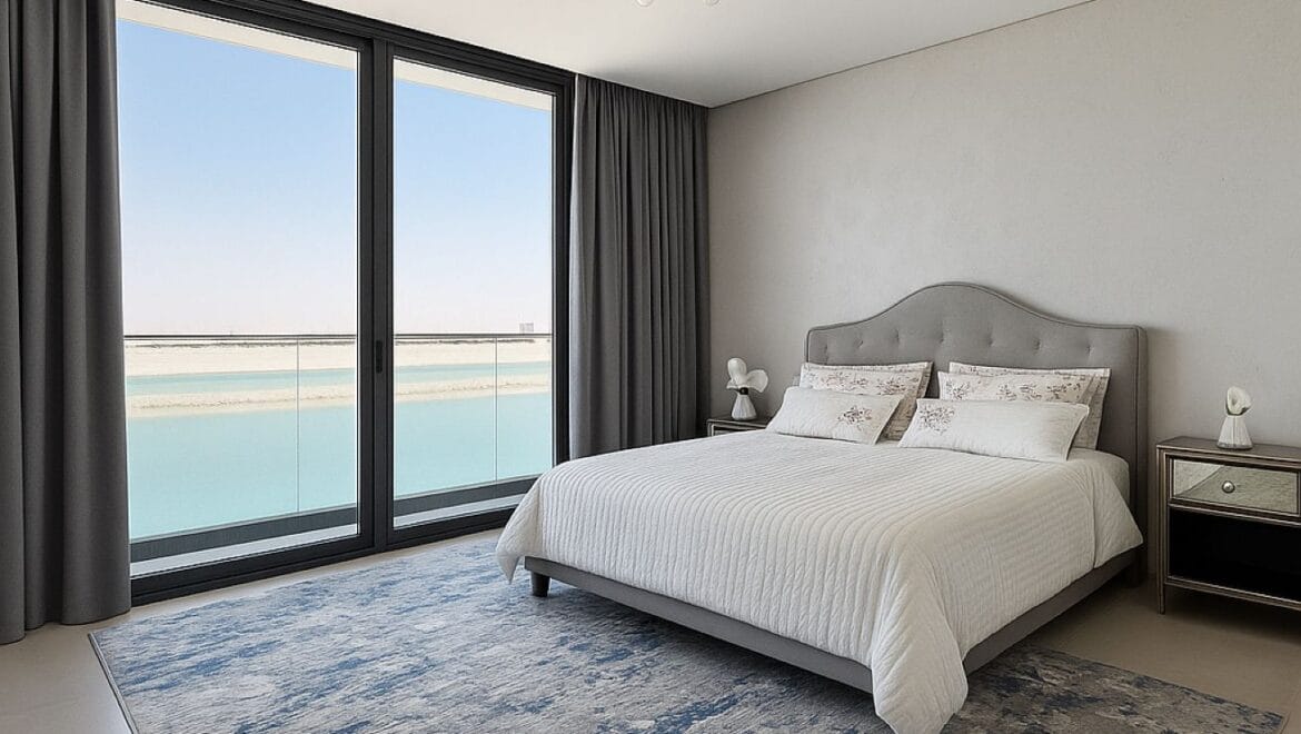 Exterior view of a modern, upgraded 4-bedroom waterfront townhouse in Ajmal Makan City within Sharjah Waterfront City, featuring private beach access.-Propertyana real estate in dubai and sharjeh