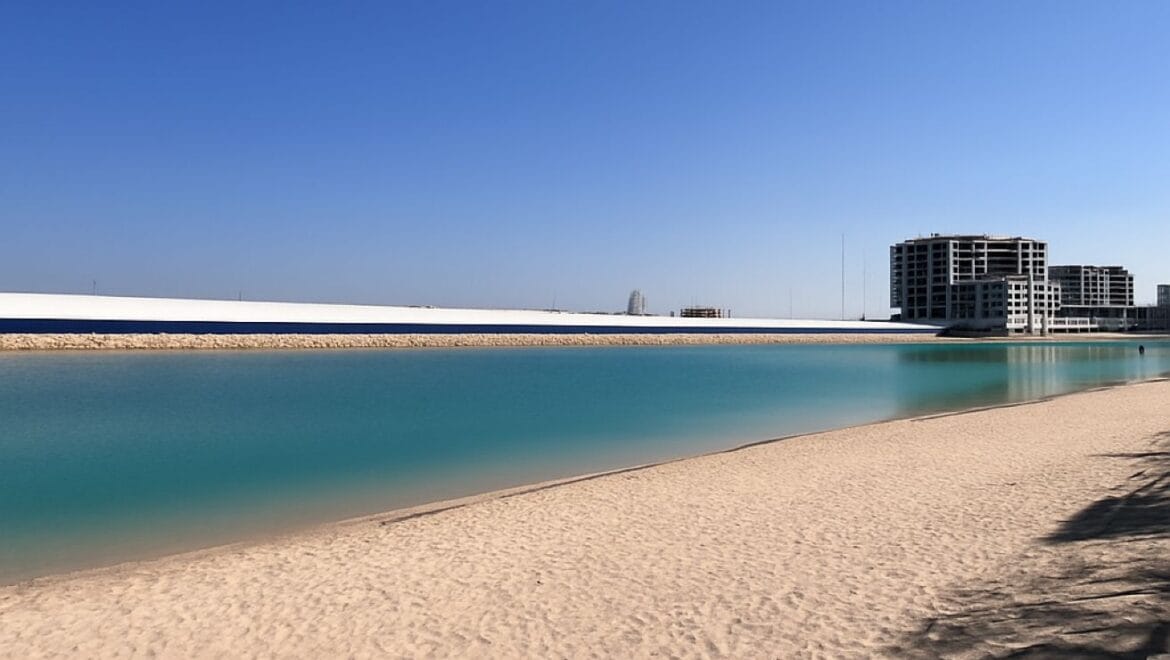 Exterior view of a modern, upgraded 4-bedroom waterfront townhouse in Ajmal Makan City within Sharjah Waterfront City, featuring private beach access.-Propertyana real estate in dubai and sharjeh