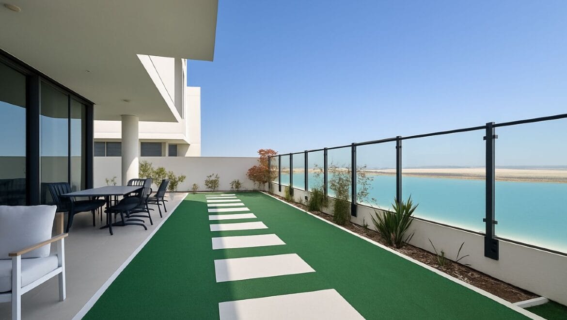 Exterior view of a modern, upgraded 4-bedroom waterfront townhouse in Ajmal Makan City within Sharjah Waterfront City, featuring private beach access.-Propertyana real estate in dubai and sharjeh