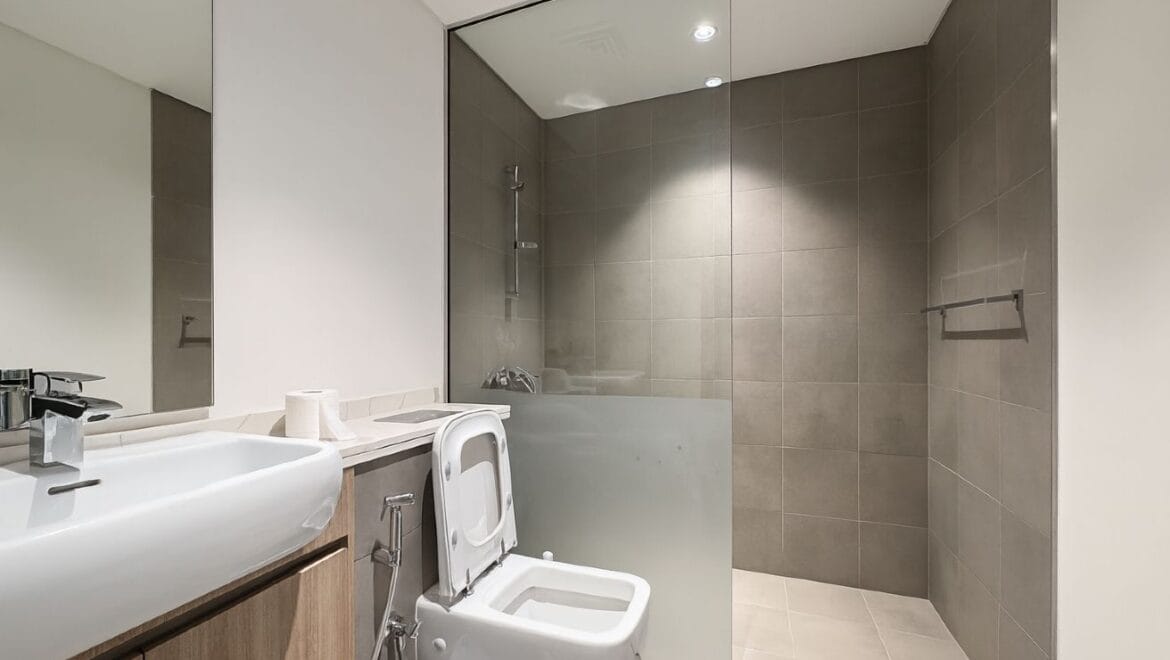 Exterior view of a modern, upgraded 4-bedroom waterfront townhouse in Ajmal Makan City within Sharjah Waterfront City, featuring private beach access.-Propertyana real estate in dubai and sharjeh