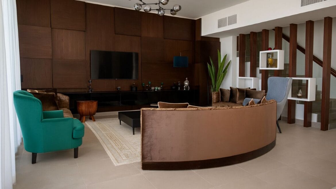 Exterior view of a modern, upgraded 4-bedroom waterfront townhouse in Ajmal Makan City within Sharjah Waterfront City, featuring private beach access.-Propertyana real estate in dubai and sharjeh