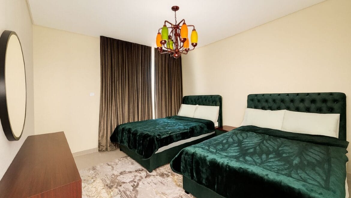 Exterior view of a modern, upgraded 4-bedroom waterfront townhouse in Ajmal Makan City within Sharjah Waterfront City, featuring private beach access.-Propertyana real estate in dubai and sharjeh