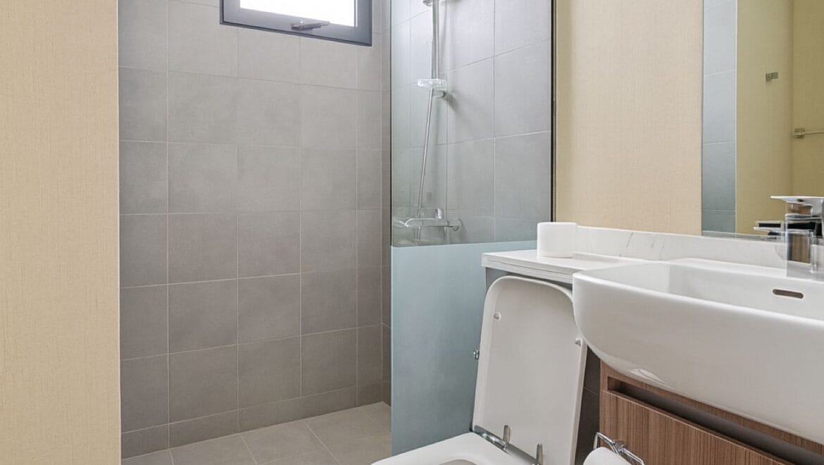 Exterior view of a modern, upgraded 4-bedroom waterfront townhouse in Ajmal Makan City within Sharjah Waterfront City, featuring private beach access.-Propertyana real estate in dubai and sharjeh