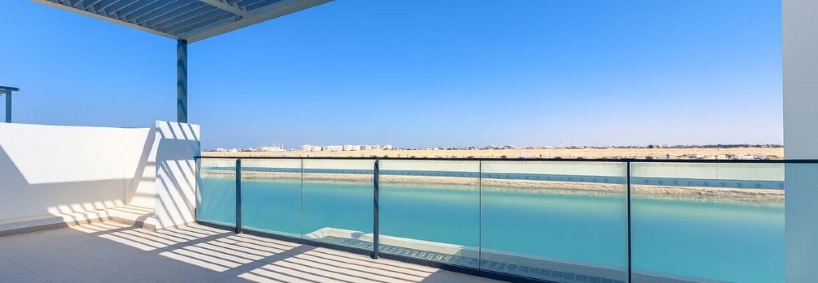 Exterior view of a modern, upgraded 4-bedroom waterfront townhouse in Ajmal Makan City within Sharjah Waterfront City, featuring private beach access.-Propertyana real estate in dubai and sharjeh