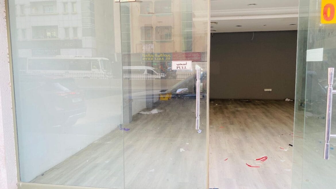 Interior view of a modern bedroom showroom inside a commercial retail space in Al Nabba, Sharjah, featuring a neatly made bed, neutral tones, and contemporary furnishings.-Propertyana real estate in dubai and sharjeh