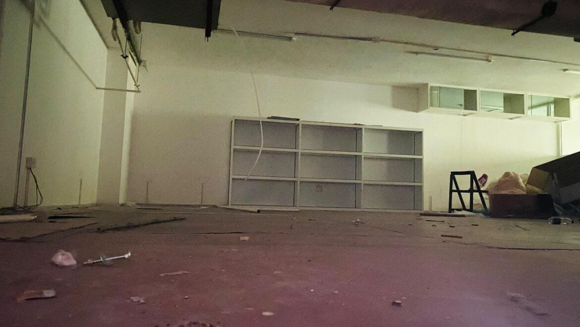 Interior view of a modern bedroom showroom inside a commercial retail space in Al Nabba, Sharjah, featuring a neatly made bed, neutral tones, and contemporary furnishings.-Propertyana real estate in dubai and sharjeh