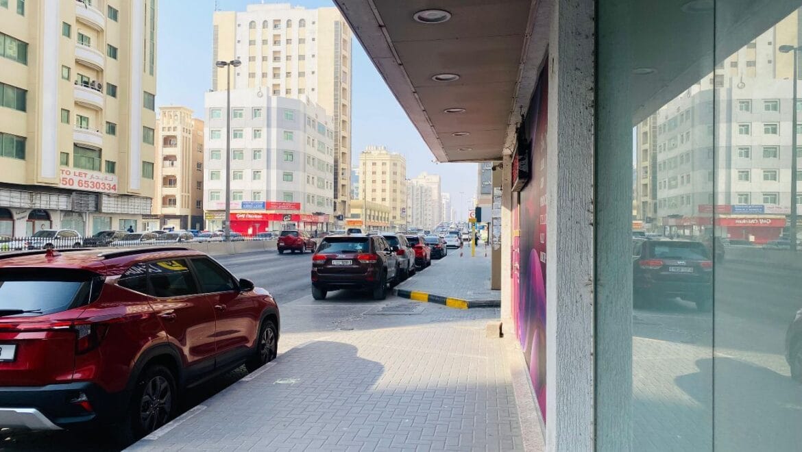 Interior view of a modern bedroom showroom inside a commercial retail space in Al Nabba, Sharjah, featuring a neatly made bed, neutral tones, and contemporary furnishings.-Propertyana real estate in dubai and sharjeh
