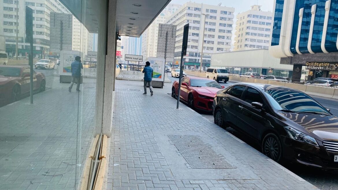 Interior view of a modern bedroom showroom inside a commercial retail space in Al Nabba, Sharjah, featuring a neatly made bed, neutral tones, and contemporary furnishings.-Propertyana real estate in dubai and sharjeh