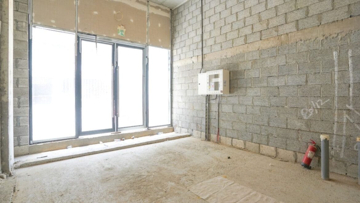 Interior of a bedroom-style showroom in a retail space at Azizi Riviera 20, Meydan, Dubai, showcasing modern furnishings.-Propertyana real estate in dubai and sharjeh