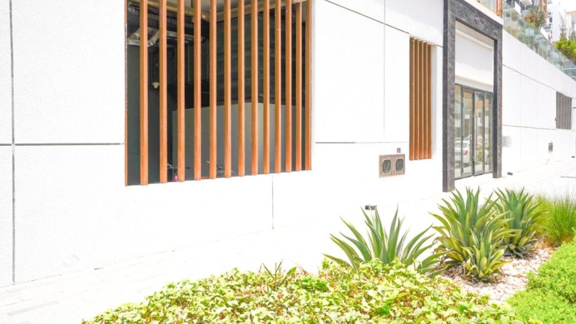 Interior of a bedroom-style showroom in a retail space at Azizi Riviera 20, Meydan, Dubai, showcasing modern furnishings.-Propertyana real estate in dubai and sharjeh