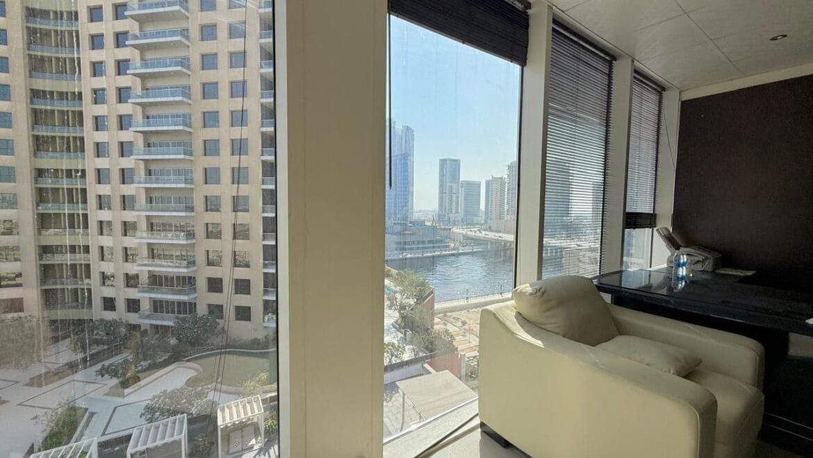 Bedroom interior at Crystal Tower, Business Bay, Dubai, with canal view-Propertyana real estate in dubai and sharjeh