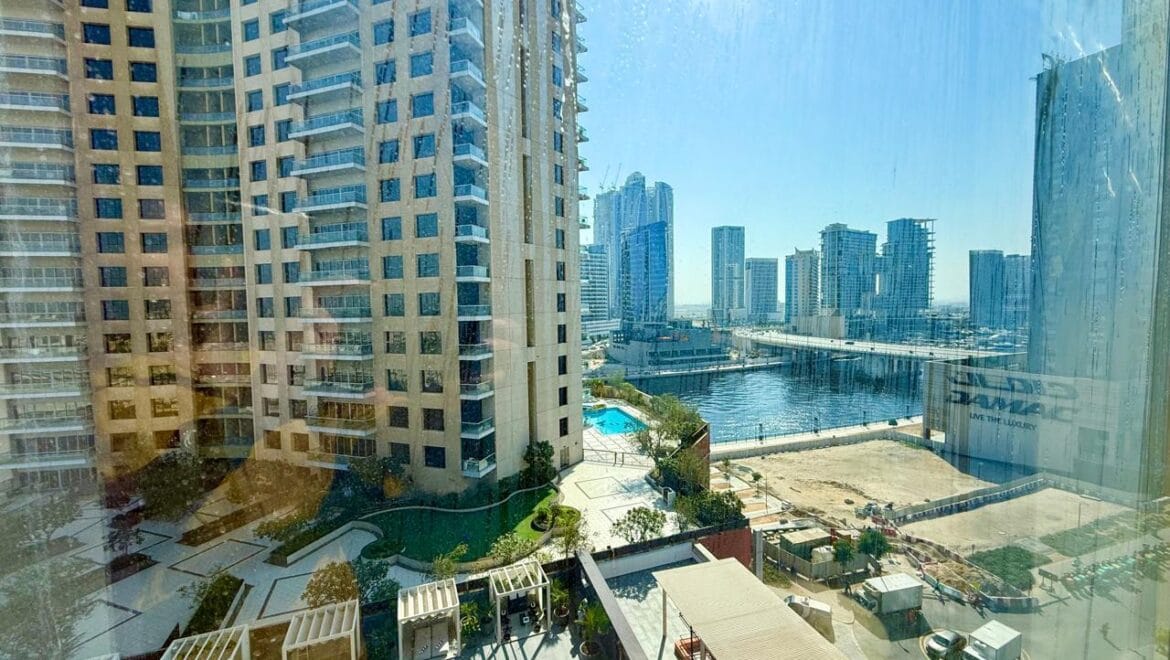 Bedroom interior at Crystal Tower, Business Bay, Dubai, with canal view-Propertyana real estate in dubai and sharjeh