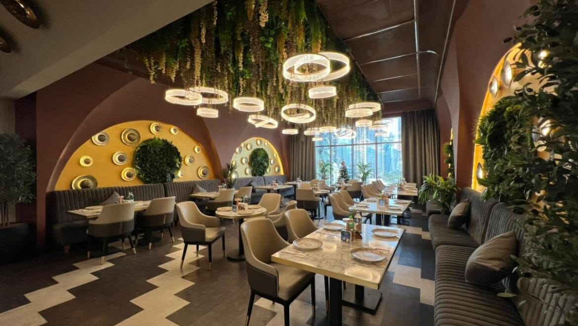 Studio bedroom in a luxury residential apartment at Aykon City Tower B, Business Bay, Dubai, featuring contemporary decor, a compact study area, and large windows with skyline views.-Propertyana real estate in dubai and sharjeh