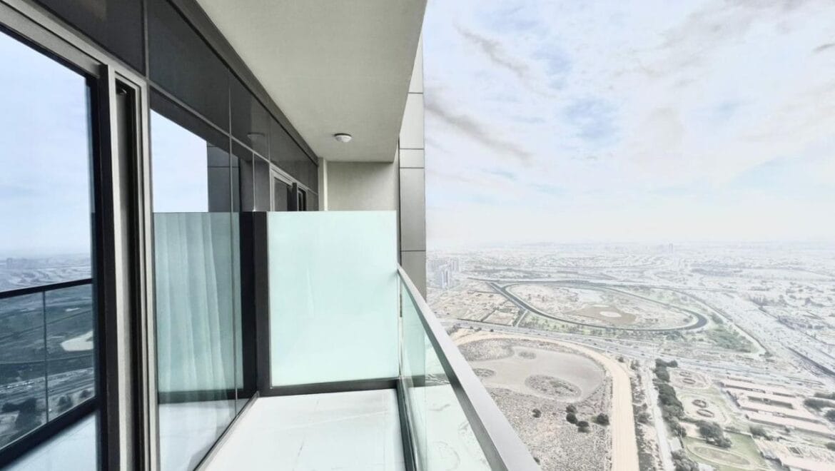 Studio bedroom in a luxury residential apartment at Aykon City Tower B, Business Bay, Dubai, featuring contemporary decor, a compact study area, and large windows with skyline views.-Propertyana real estate in dubai and sharjeh