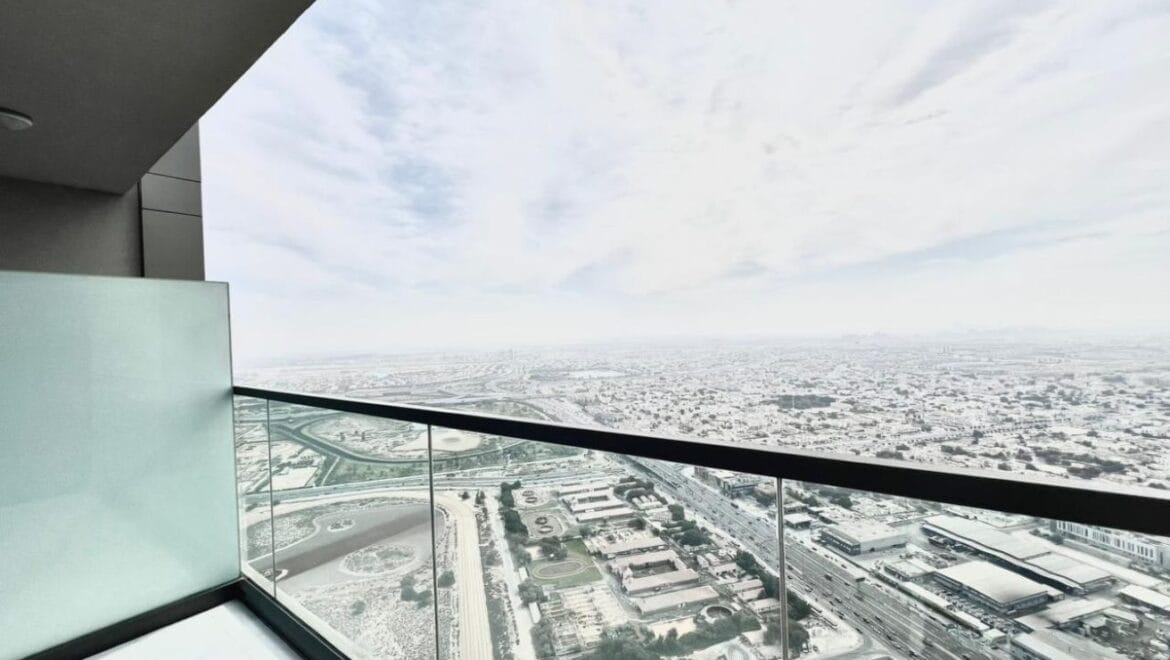 Studio bedroom in a luxury residential apartment at Aykon City Tower B, Business Bay, Dubai, featuring contemporary decor, a compact study area, and large windows with skyline views.-Propertyana real estate in dubai and sharjeh