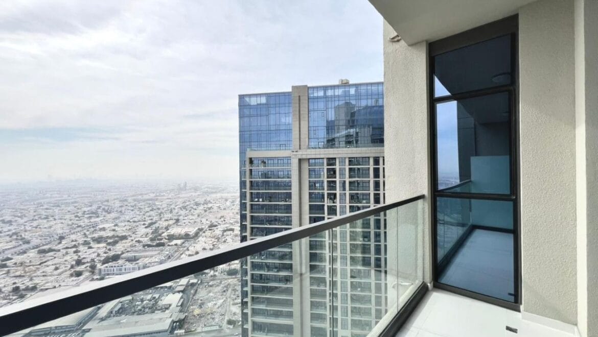 Studio bedroom in a luxury residential apartment at Aykon City Tower B, Business Bay, Dubai, featuring contemporary decor, a compact study area, and large windows with skyline views.-Propertyana real estate in dubai and sharjeh