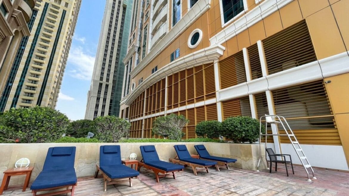 Bright, modern 2-bedroom apartment interior in Elite Residence, Dubai Marina, Dubai, featuring contemporary furnishings and large windows.-Propertyana real estate in dubai and sharjeh